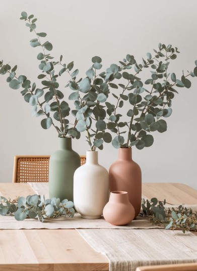 Fresh Eucalyptus and White Ceramic Vases